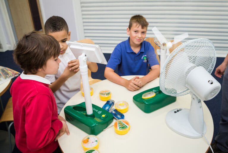ECO" smart education showing pupils with a completed project building a wind turbine